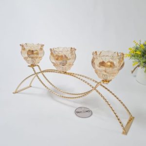 Candelabro puente metálico rosas vidrio ámbar 3 velas mesa